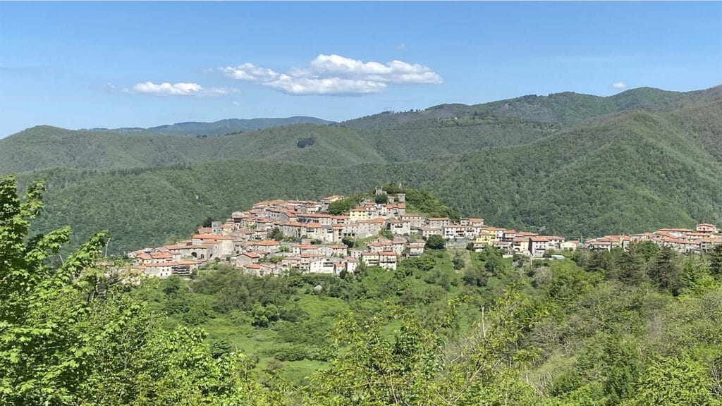 Montefegatesi village surrounded by mountains and trees