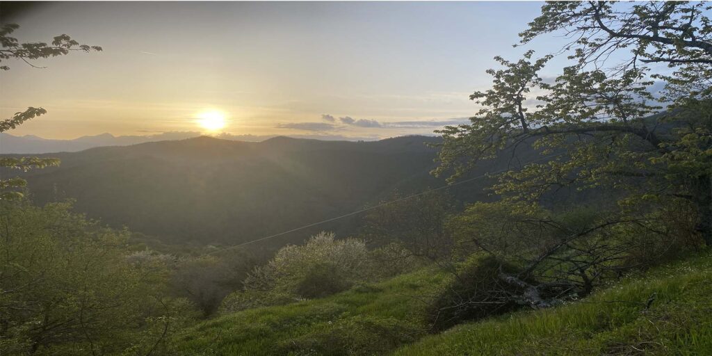 sunset over montefegatesi in april