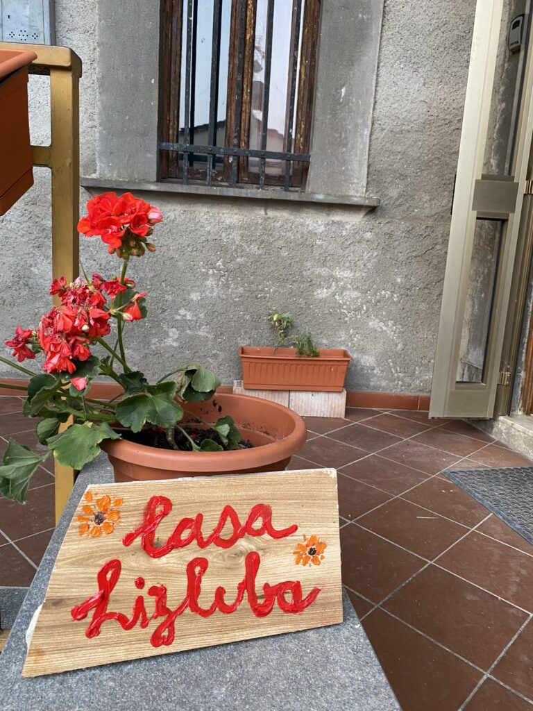 sign showing name of house Casa Lizluba in front of house