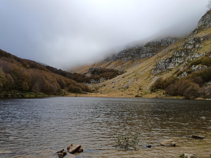 river surrounded by mountains in Italy