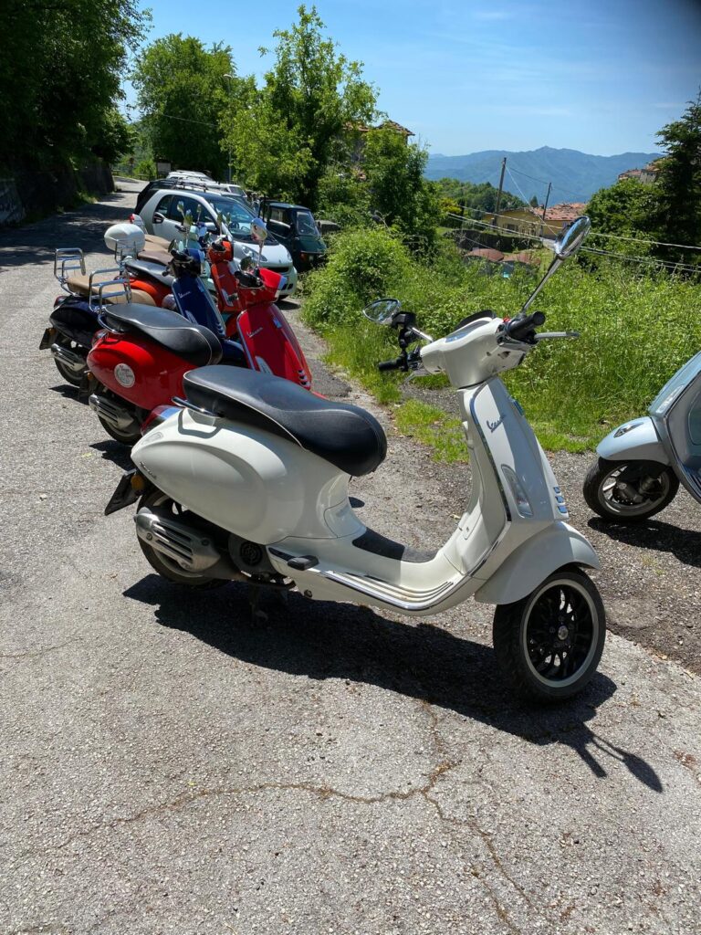 white vespa scooter