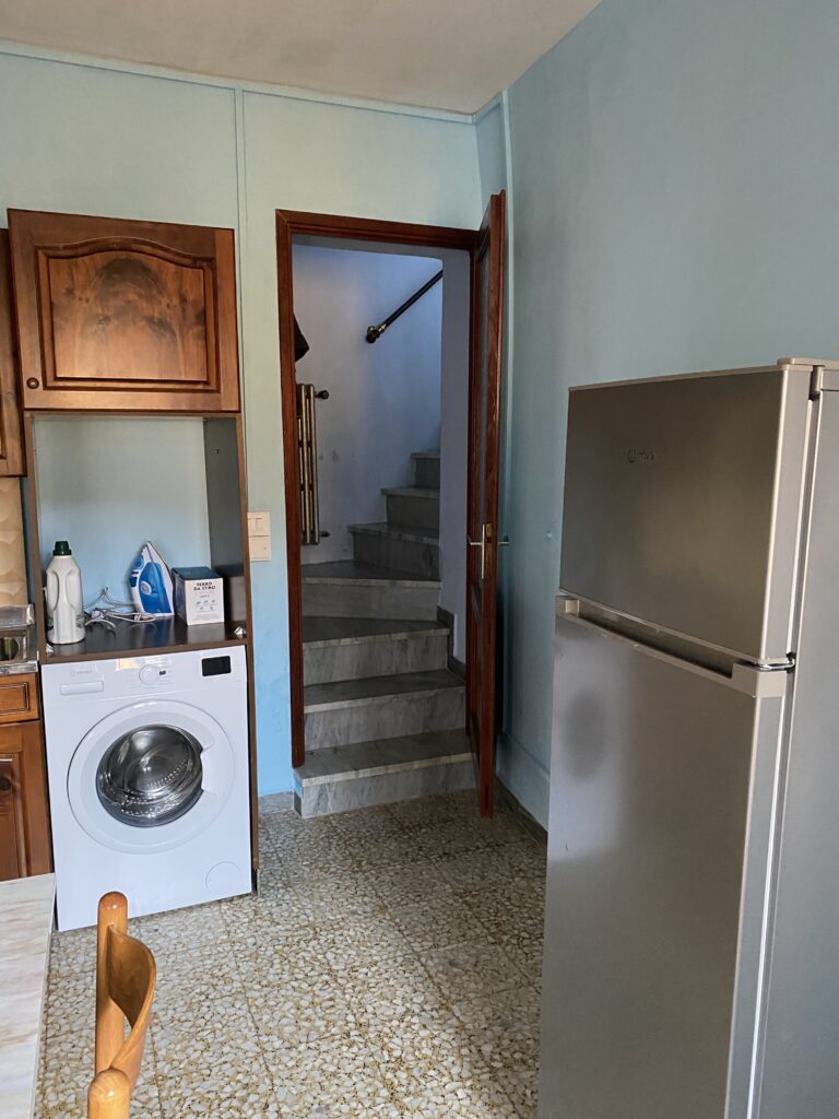 kitchen with fridge and washing machine
